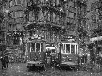 trams at galatasaray square on a snowy day, beyoglu, istanbul, 1960